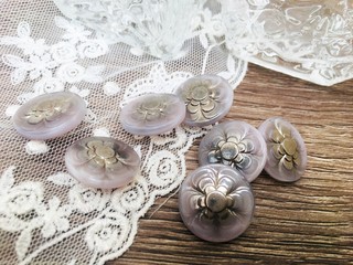 Fototapeta na wymiar czech glass flower buttons in lavender color