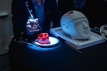 Medical students learn about brain surgery tools