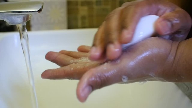 Black man washing hands in slow motion