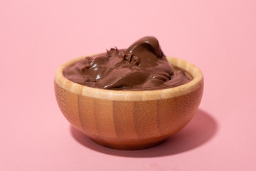 full wooden bowl of hazelnut chocolate spread 
