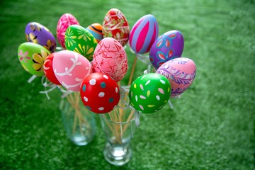 Easter eggs in bottle on grass and with copy space.  Easter Festival.