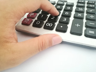 Fototapeta na wymiar hand with calculator and number
