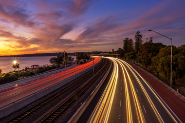 Fototapeta na wymiar Sunset long exposure motion blur at freeway overpass in Perth, Australia