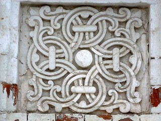 Fancy patterns in a square niche, carved out of stone