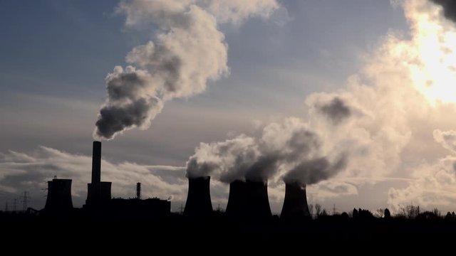 Manchester power station and chimneys with smoke UK 4K