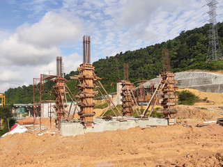 Column timber form work and reinforcement bar at the construction site. Installed by construction workers. The structure supported by temporary wood support.