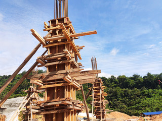 Column timber form work and reinforcement bar at the construction site. Installed by construction...