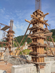 Column timber form work and reinforcement bar at the construction site. Installed by construction workers. The structure supported by temporary wood support.