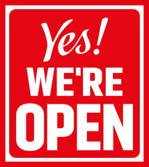 Yes we're open sign. Letter board isolated on red background