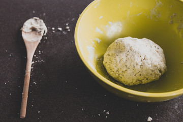 healthy homemade food, preparing homemade herbs and sesame bread by making the dough