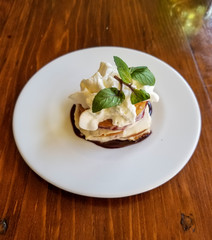 Delicious cookie desert with cream and mint