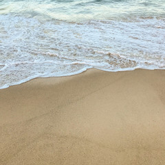Fototapeta na wymiar Sea Foam on Beach