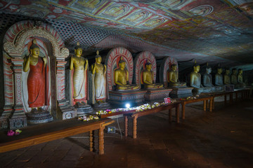 Ancient sculptures of Buddha in the cave temple of Rangiri Dambulu Vihara. Dambulla, Sri Lanka
