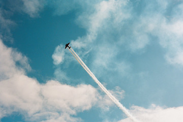 Airplane streaking across the sky