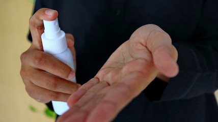 Unfocused, Blurry selective focus image of Spray disinfectant liquid into the hands, to kill the virus