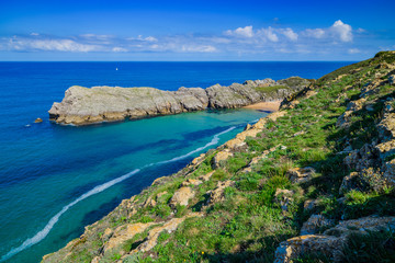 Incredible cliffs on the coast near the village of Liencres. Cantabria. Northern coast of Spain