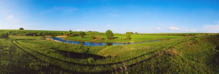 Spring landscape with river and blue sky