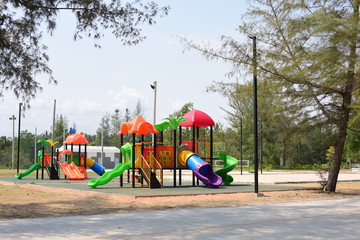Fototapeta na wymiar New play equipment, beautiful colors at the village playground