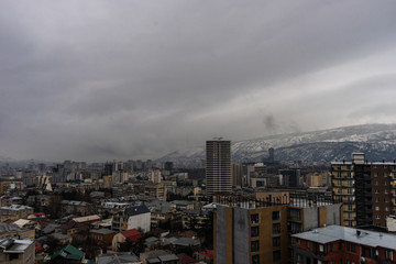 Naklejka na ściany i meble Dramatic sky over Tbilisi city