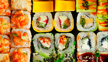 Japanese food: Set of salmon sushi and rolls with salmon and eel