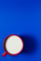 big mash with milk on a colored background