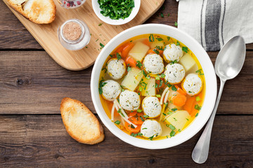 Fresh homemade chicken meatball soup with vegetables.