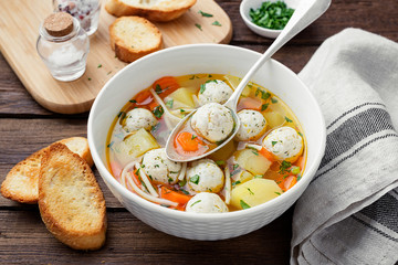 Fresh homemade chicken meatball soup with vegetables.