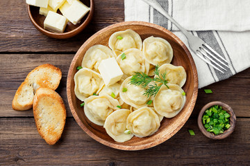 Homemade meat dumplings - russian pelmeni. Dumplings, filled with meat, ravioli.
