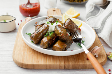Dolma - stuffed grape leaves with rice and meat. Traditional Turkish and Greek dish