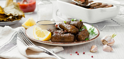 Dolma - stuffed grape leaves with rice and meat. Traditional Turkish and Greek dish