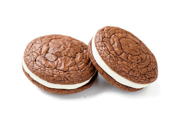 Chocolate  brownie - sandwich cookies with cream cheese filling isolated on white background