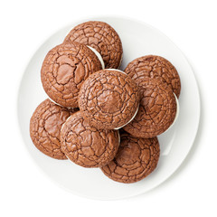 Chocolate  brownie - sandwich cookies with cream cheese filling isolated on white background