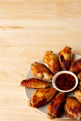 Grilled chicken wings with spicy isaan dipping sauce