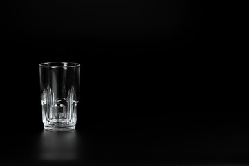 empty glass  on a dark background