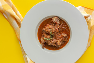 Lamb stew with aromatic herbs seen from above