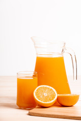 glass and jar of fresh orange juice