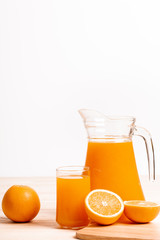 glass and jar of fresh orange juice
