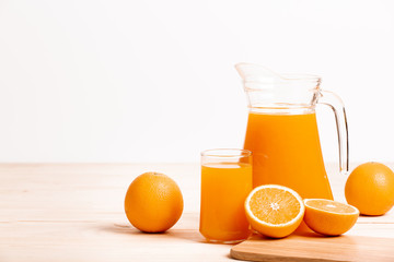 glass and jar of fresh orange juice