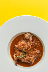 Lamb stew with aromatic herbs seen from above