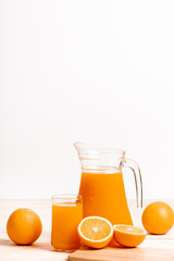 glass and jar of fresh orange juice