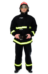 Portrait of a firefighter in black uniform in a red helmet on a white isolated background
