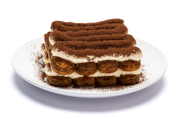 Classic tiramisu dessert on ceramic plate isolated on white background with clipping path