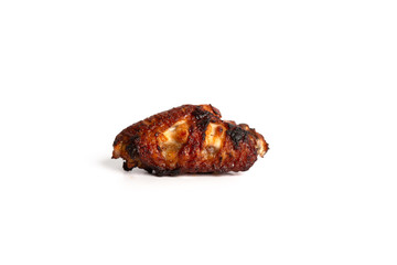 barbecue chicken wings close up on wooden tray shot with selective focus white background