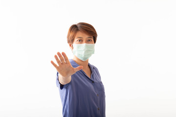 Asia woman aseptic medical mask protected on her face, hands, stopped without signs. Air pollution, viruses, the concept of the pandemic of coronavirus