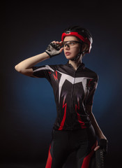 a girl cyclist in a helmet