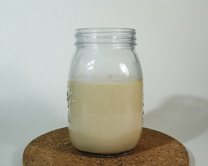 A Glass of Ice Coffee Latte on Cork Coaster