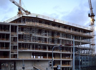 Cranes build houses in Prague