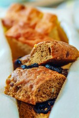 Closeup Shot Of Olive Bread In White Napkin Tray