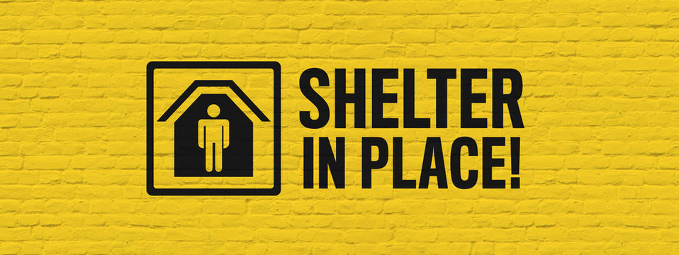 Shelter in place ! on yellow brick background