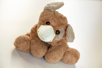 safety toy, a teddy bear with a ffp2 mask, safe children's toys